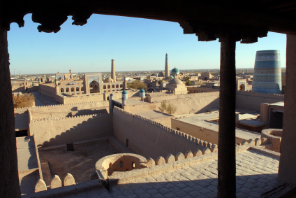 The Kalta Minor minaret (Guyok Minar / Green Minaret) is visible in the right in Itchan Kala, which is the walled inner town of the city of Khiva, in Khorezm Province, Uzbekistan, and is a UNESCO World Heritage Site.